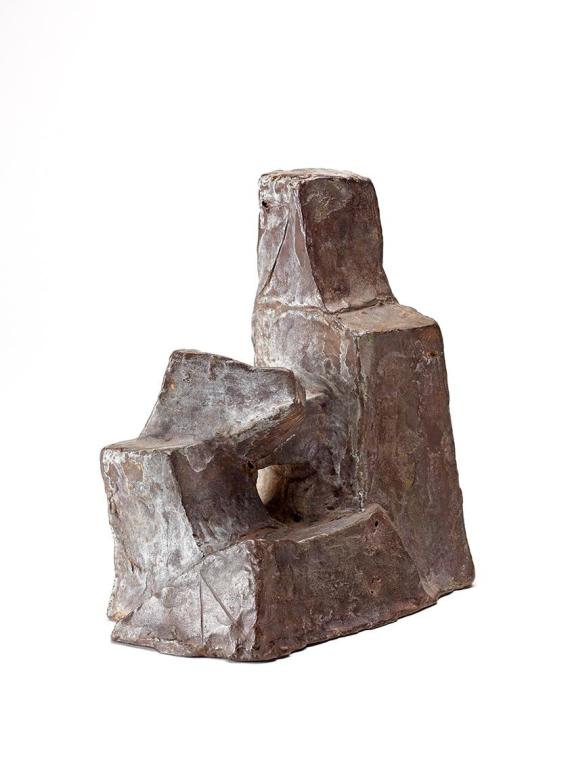 Kleine sitzende Figur