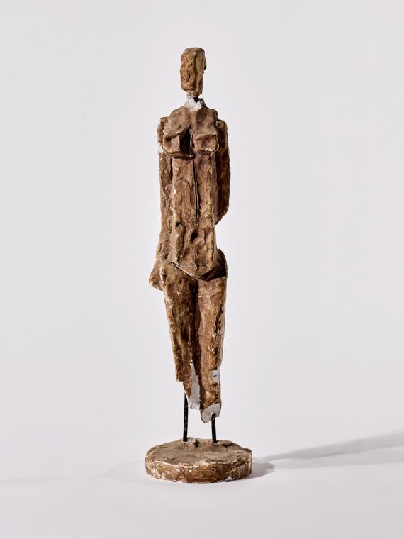 Kleine stehende weibliche Figur