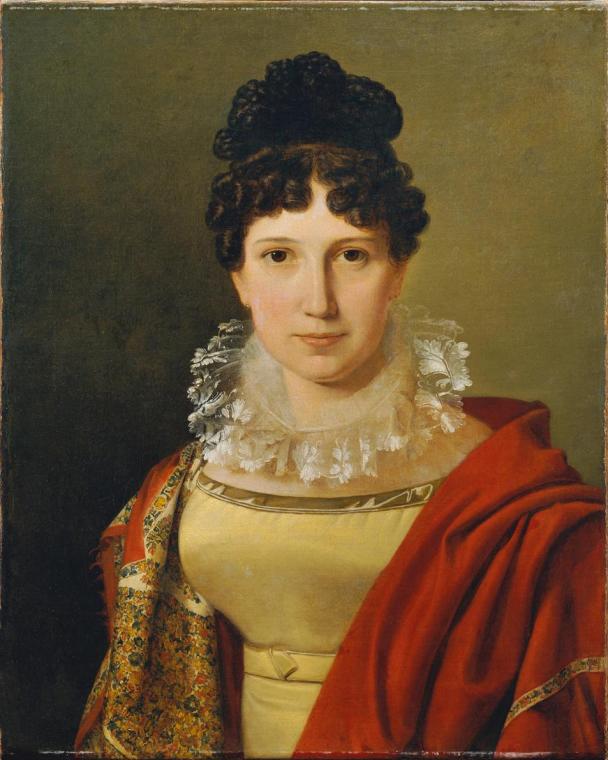 The image depicts a woman looking directly at the viewer. She has a curly hairstyle and wears a decorative lace collar. Her attire consists of a sleeveless top and a draped shawl over her shoulders. In the background, there is a solid-colored area that focuses attention on the person.

[AI-generated with ChatGPT]