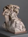 The sculpture depicts a dynamic composition of three figures intertwined closely. A male figure sits prominently in the foreground, while two female figures lean on him and embrace his shoulders. The representation conveys a strong emotional bond between the figures, each taking different poses and exuding a sense of movement and interaction. The texture of the surface is detailed and reminiscent of worked material.

[AI-generated with ChatGPT]