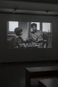 Nadim Vardag, Entropie, 2012, Video, s/w, Ton, HD, 12 min (Loop), Duraclear Print auf Acrylglas…
